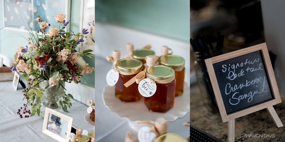 Floral event display with bouquets, jars of iced tea, and a chalkboard sign on a table