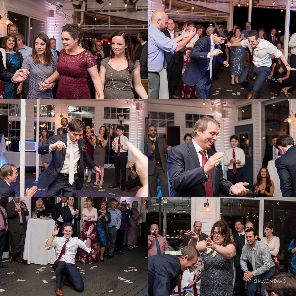 Guests dancing at a lively indoor party, with people clapping, smiling, and tossing confetti