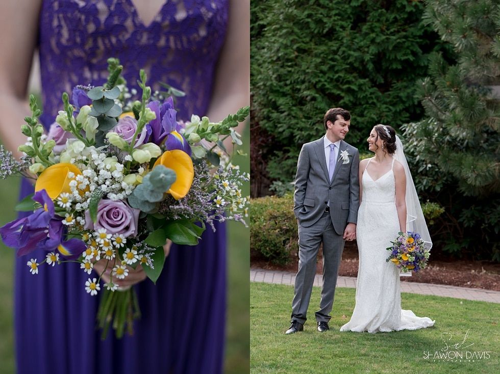 Bride and groom outdoors, with purple bouquet in foreground