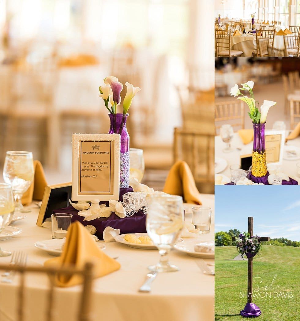 Wedding table centerpiece with purple flowers and gold accents in a bright reception hall