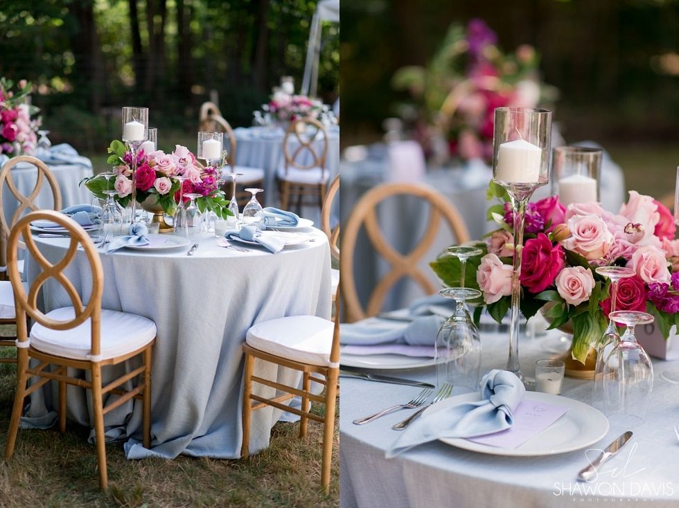 Elegant outdoor wedding reception tables with white linens, pink floral centerpieces, and gold chairs