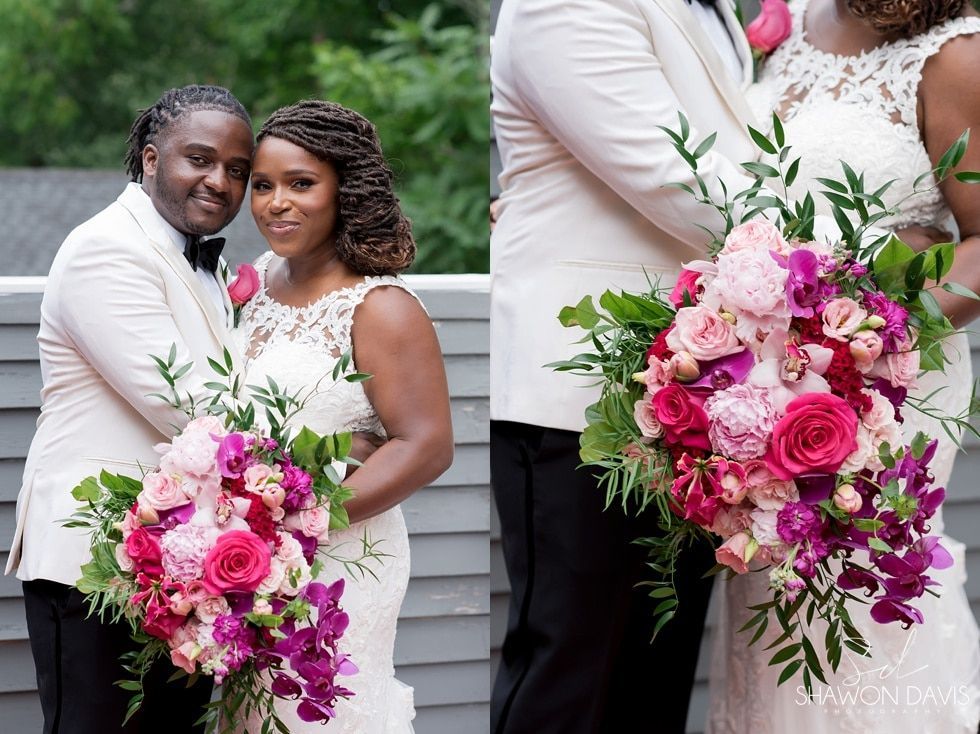 Newlyweds pose with bright pink and white wedding bouquets outdoors on a porch