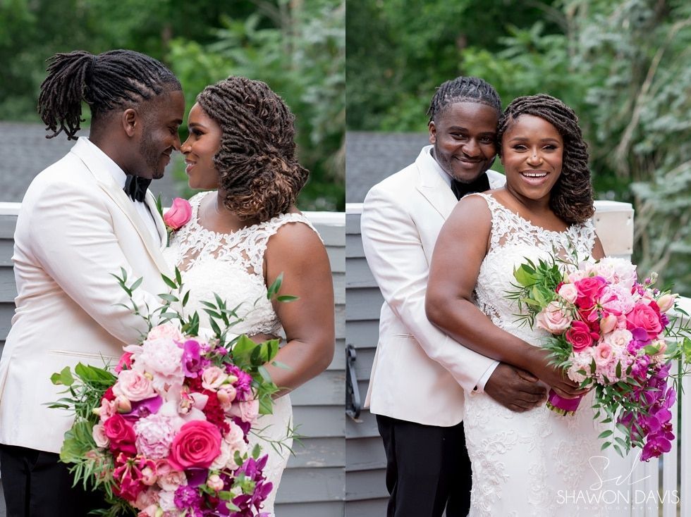Two couples in white wedding attire pose outdoors with pink and white bouquets.