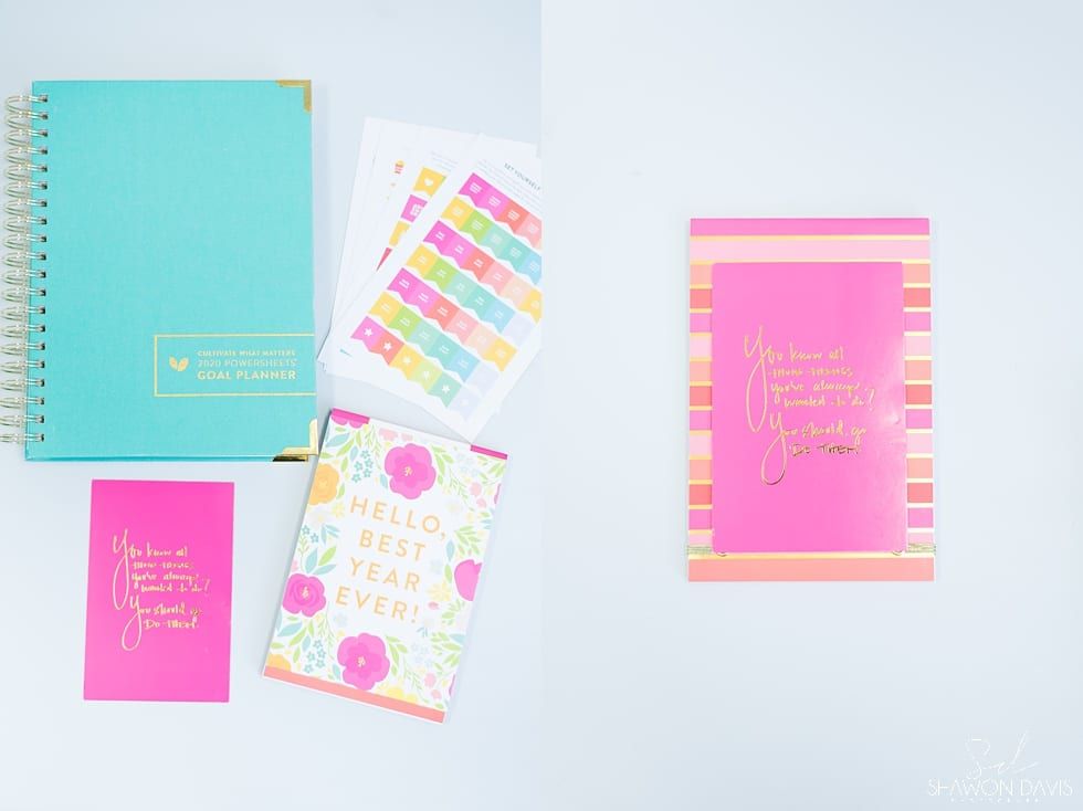 Pastel stationery set with notebooks, planners, and colorful tabs on a white background