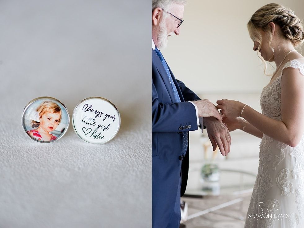 Wedding detail with bride and groom holding hands beside personalized cufflinks.