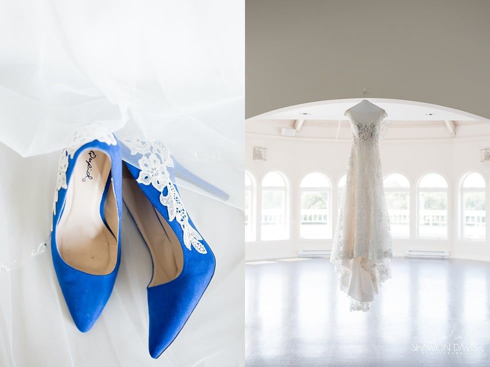 Blue high heels beside a white wedding dress in a bright bridal salon