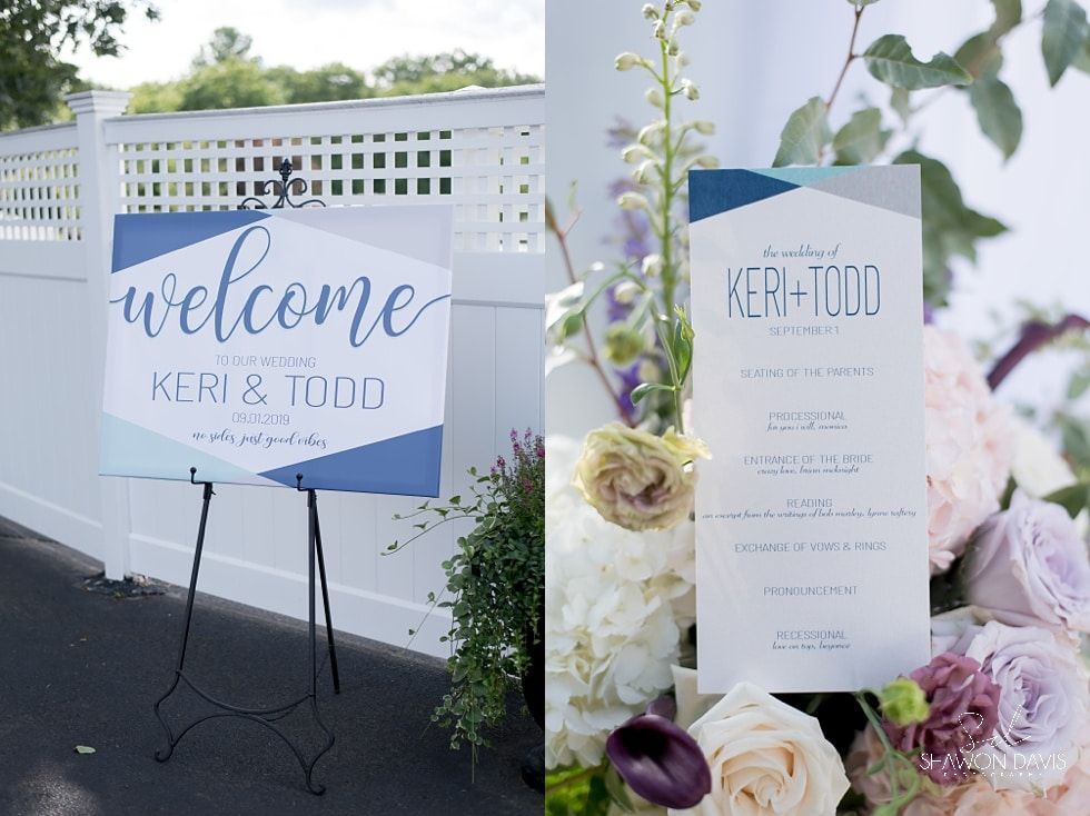 Wedding welcome sign and guest list display with blue-and-white florals outdoors