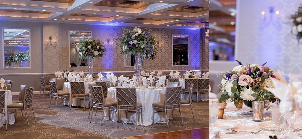 Elegant banquet hall with round tables, white chairs, soft lighting, and floral centerpieces