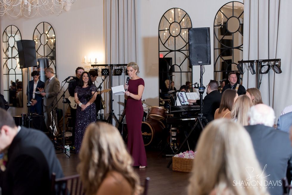 Live band performing at an elegant indoor event with guests seated in the foreground