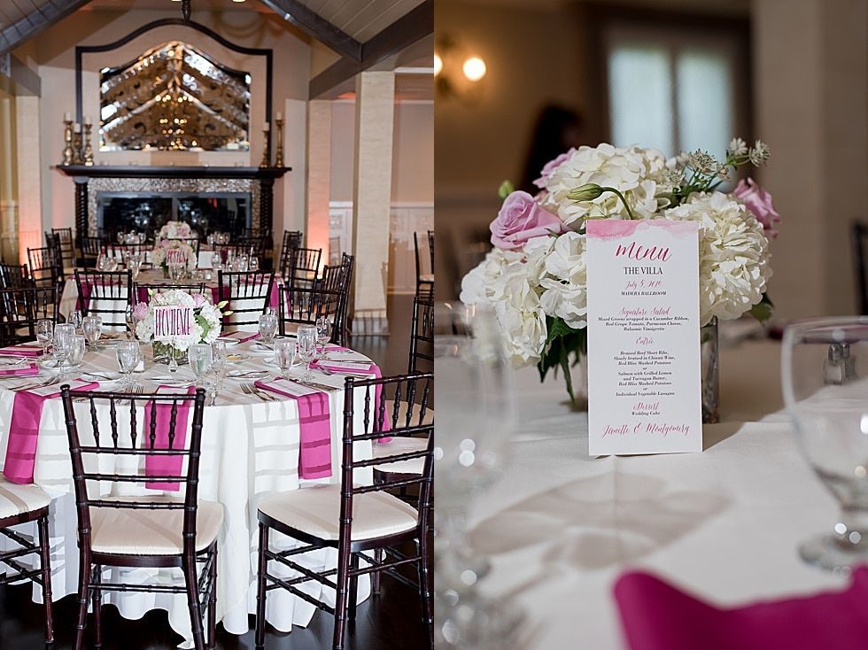 Elegant banquet hall with pink-and-white floral table settings and a mirrored fireplace centerpiece