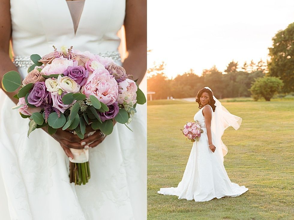 Bride holding a pink and purple bouquet in a white dress at sunset on a grassy field