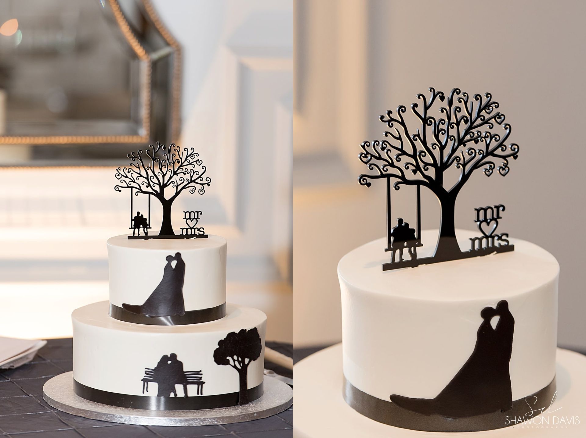 Two white wedding cakes with black silhouetted couple and tree toppers on a table