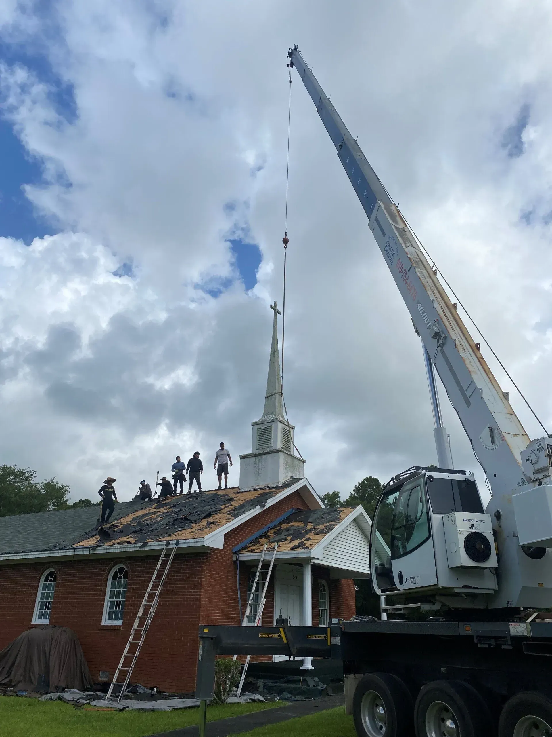 People On Roof - Calabash, NC - Roof Doctor Of The Carolinas Inc.