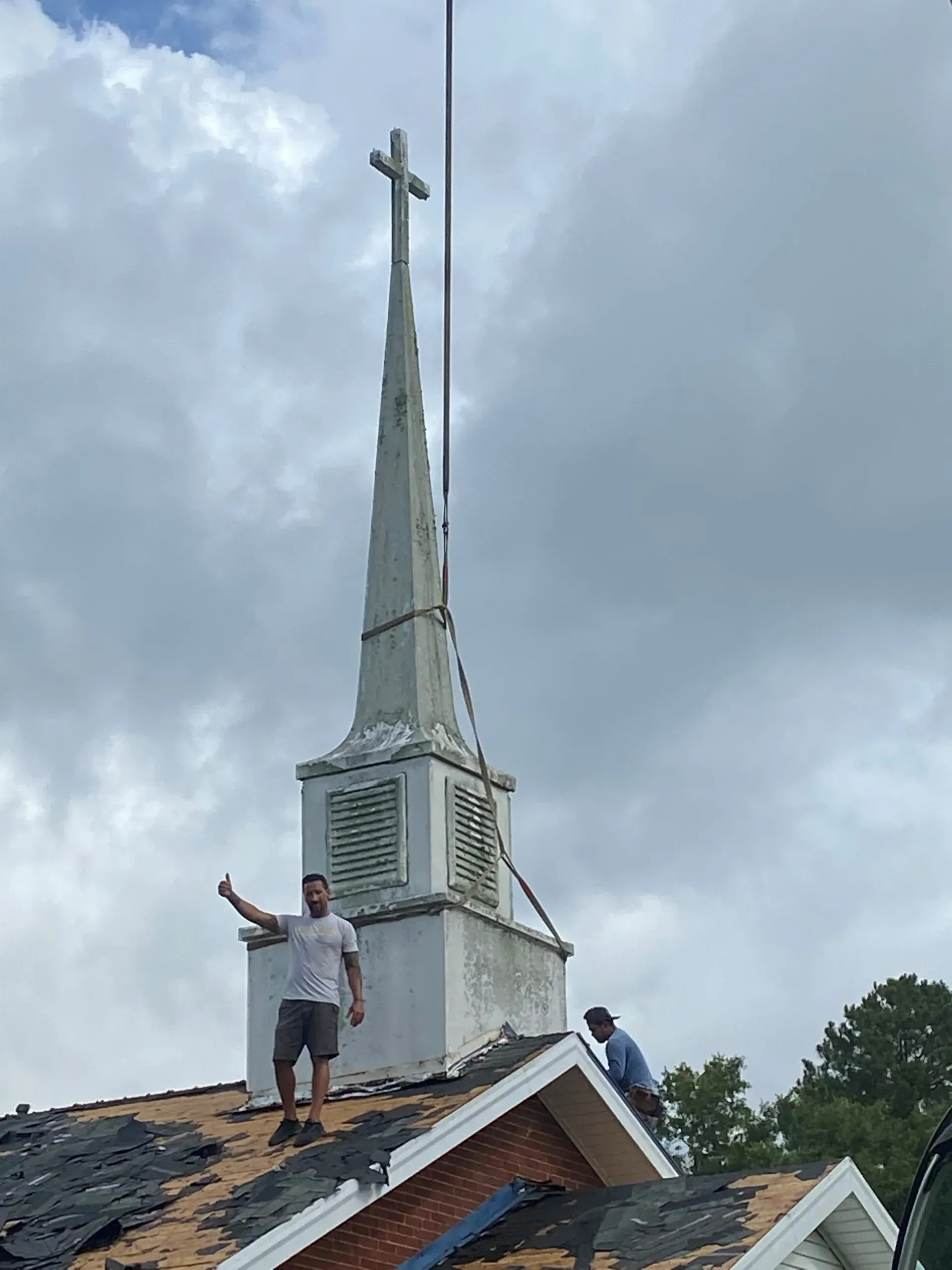 Person On Roof - Calabash, NC - Roof Doctor Of The Carolinas Inc.