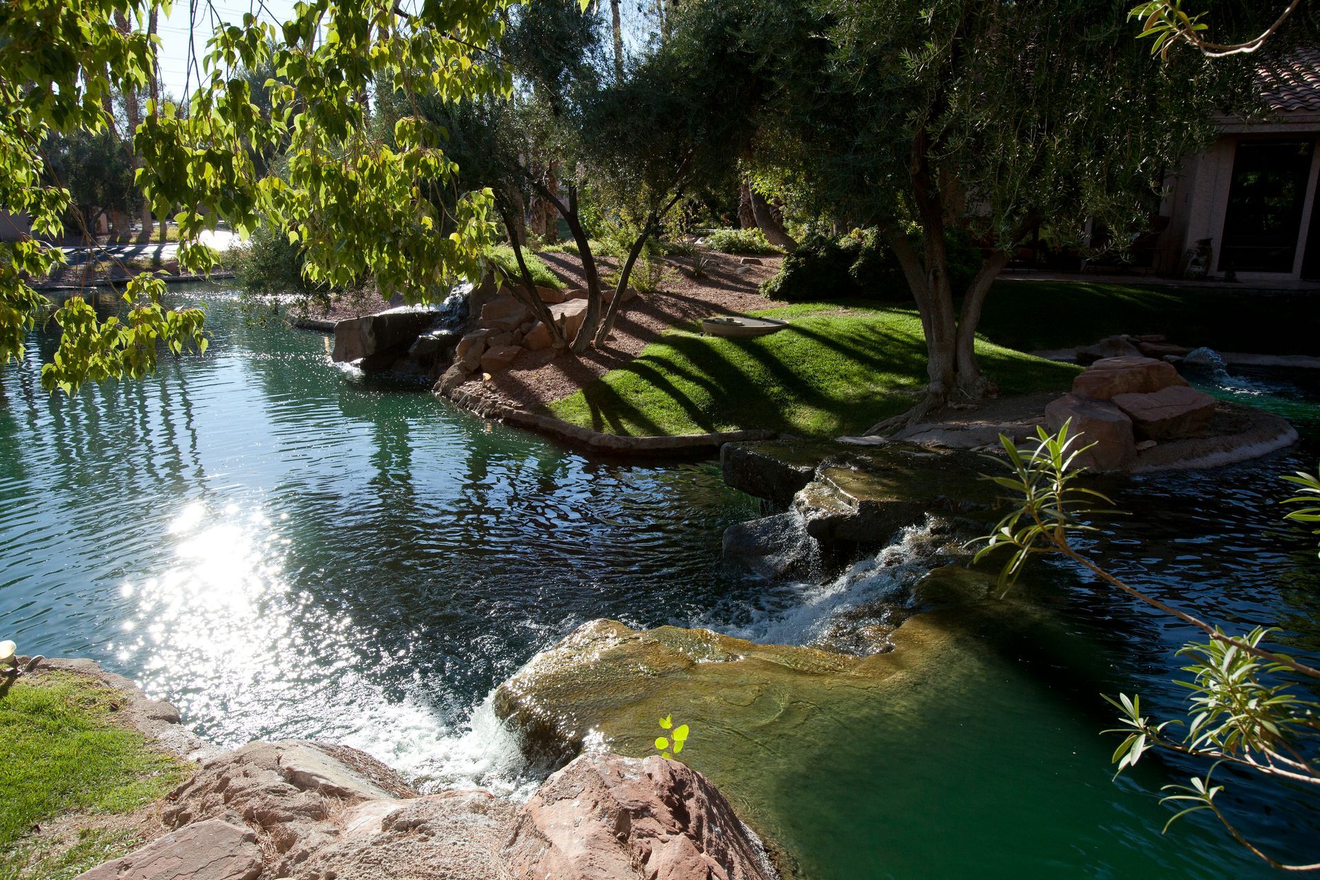 A large body of water surrounded by trees and rocks