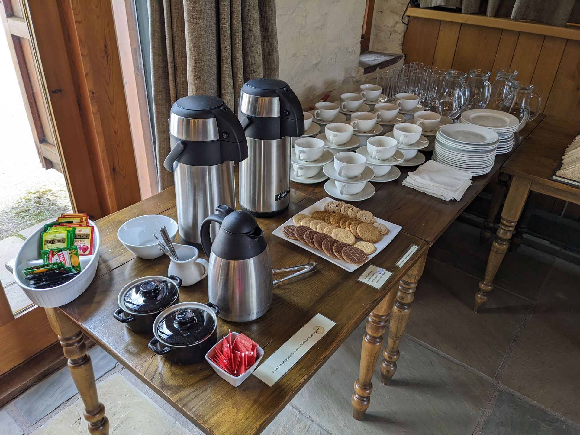 tea and coffee station with cups and saucers