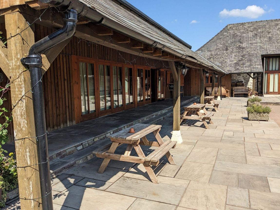 Picnic benches underneath a lean to area