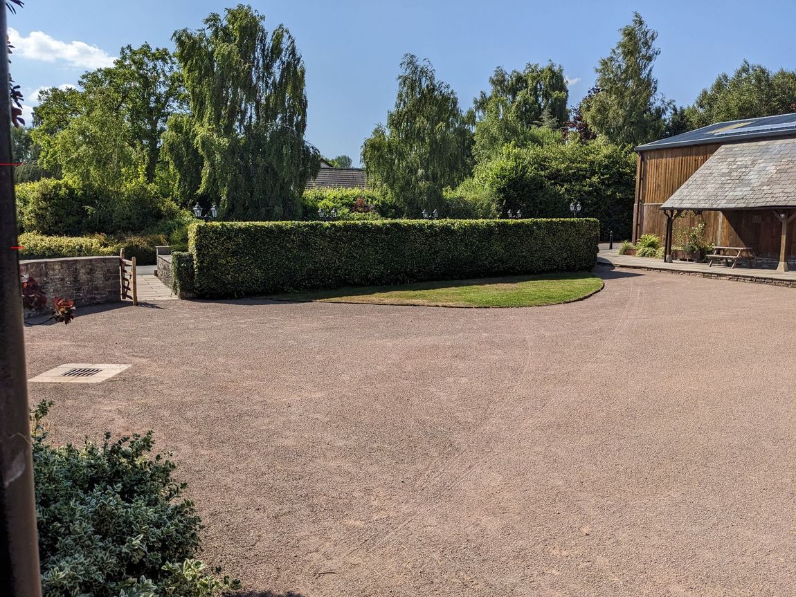 Large gravelled area in between the Barn and Grain Shed referred to as the Front Courtyard