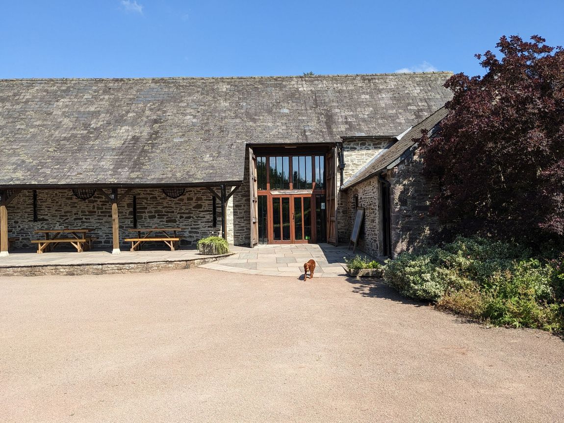 Sloping flagstone flooring to the main entrance of the Barn