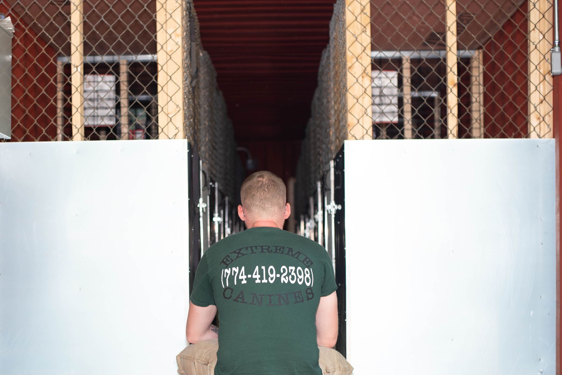 Man Facing The Dog Cages — Middleborough, MA — G-Force Kennels