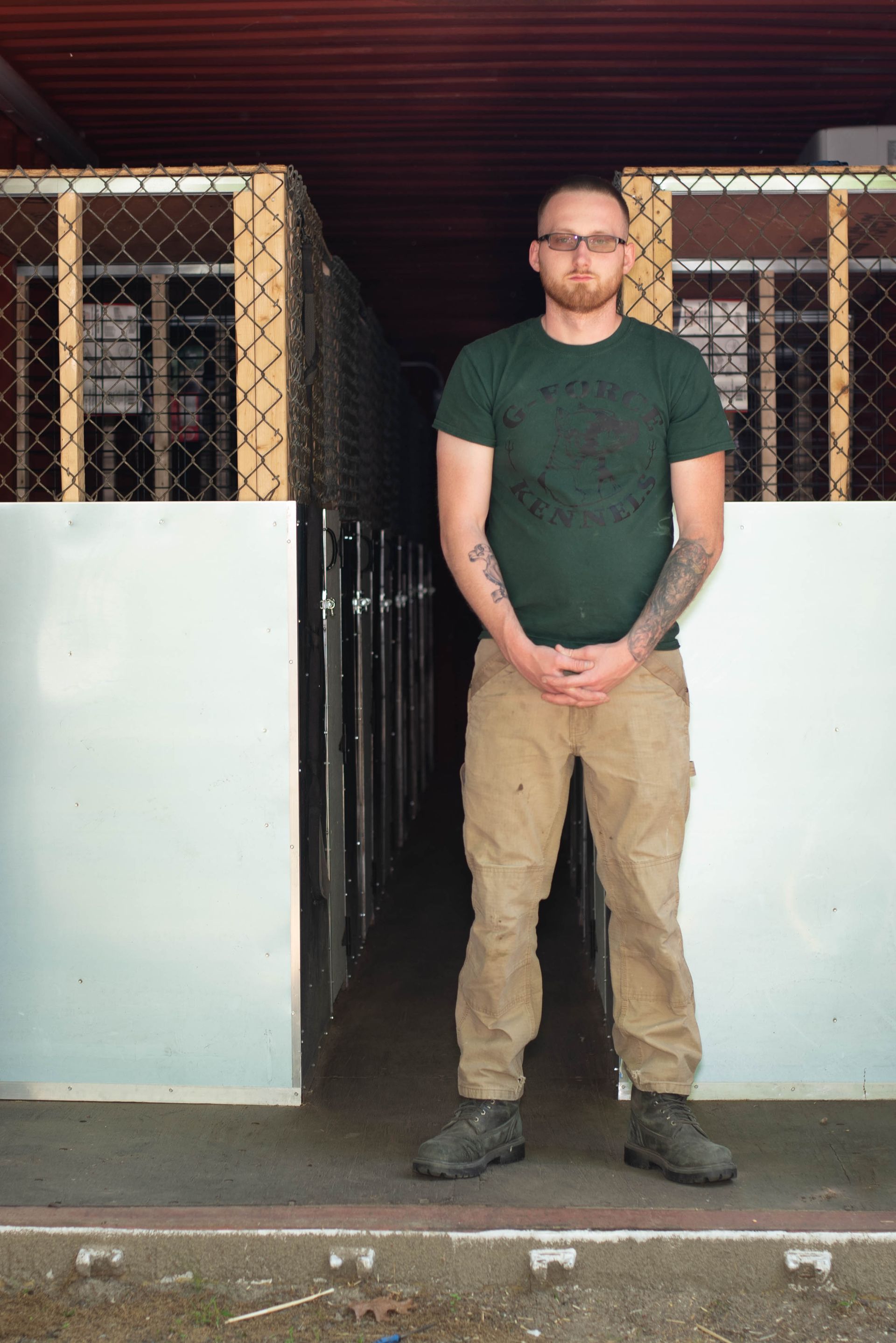 Man Standing Near The Dog Cages — Middleborough, MA — G-Force Kennels