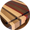 Wooden cutting board with striped wood grain and rounded corners