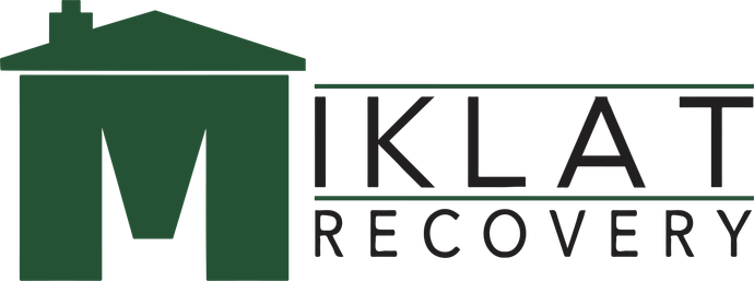 Green logo of house-shaped 