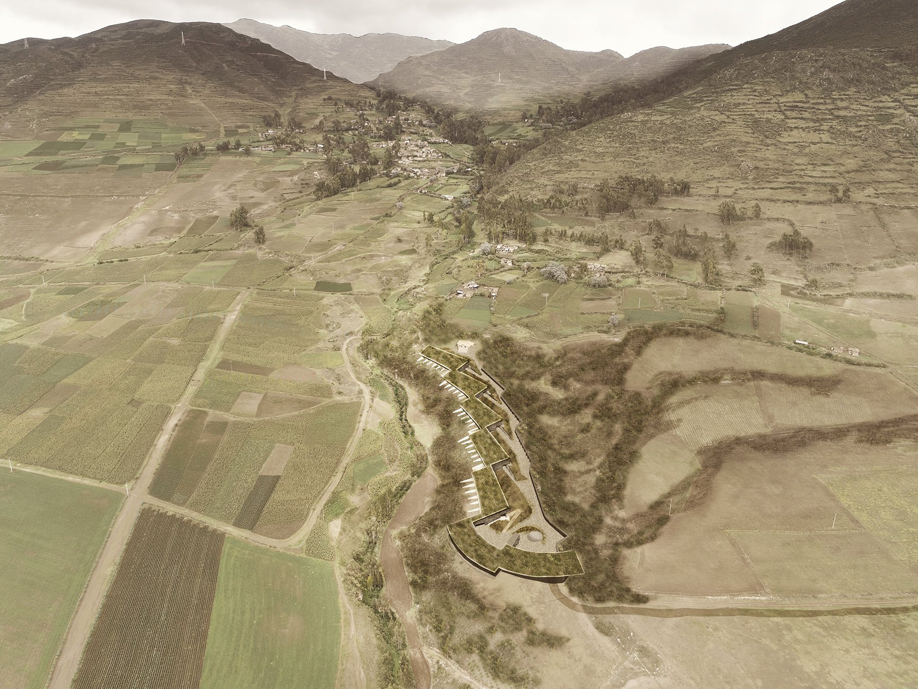 Una vista aérea de un río que corre por un valle rodeado de montañas.