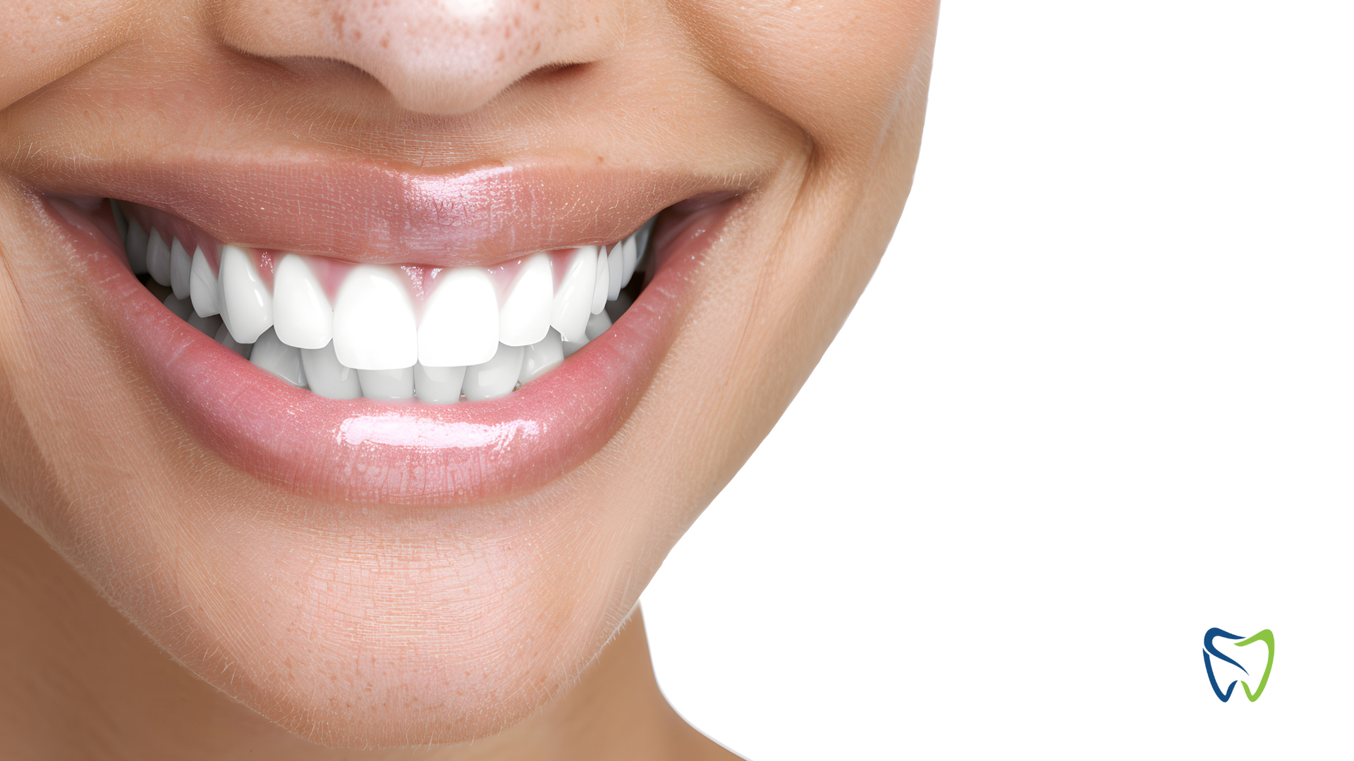 Close-up of a person smiling, revealing bright white teeth and pink lips.