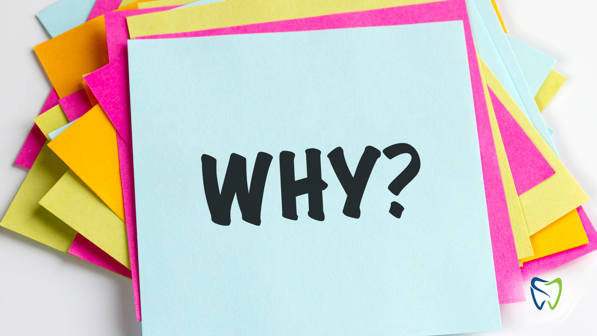 Stack of colorful sticky notes with the word 
