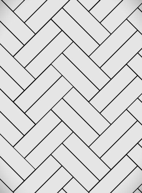 Herringbone pattern of white rectangular tiles with dark grout.