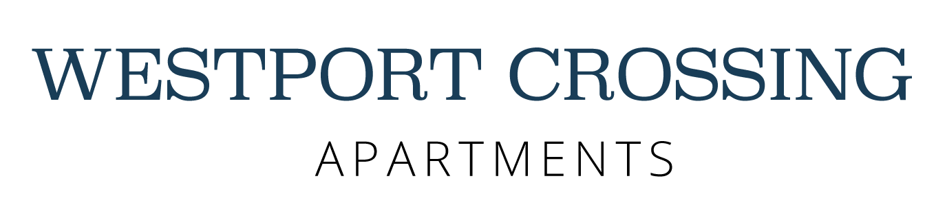 Westport Crossing Apartments logo in blue and black text