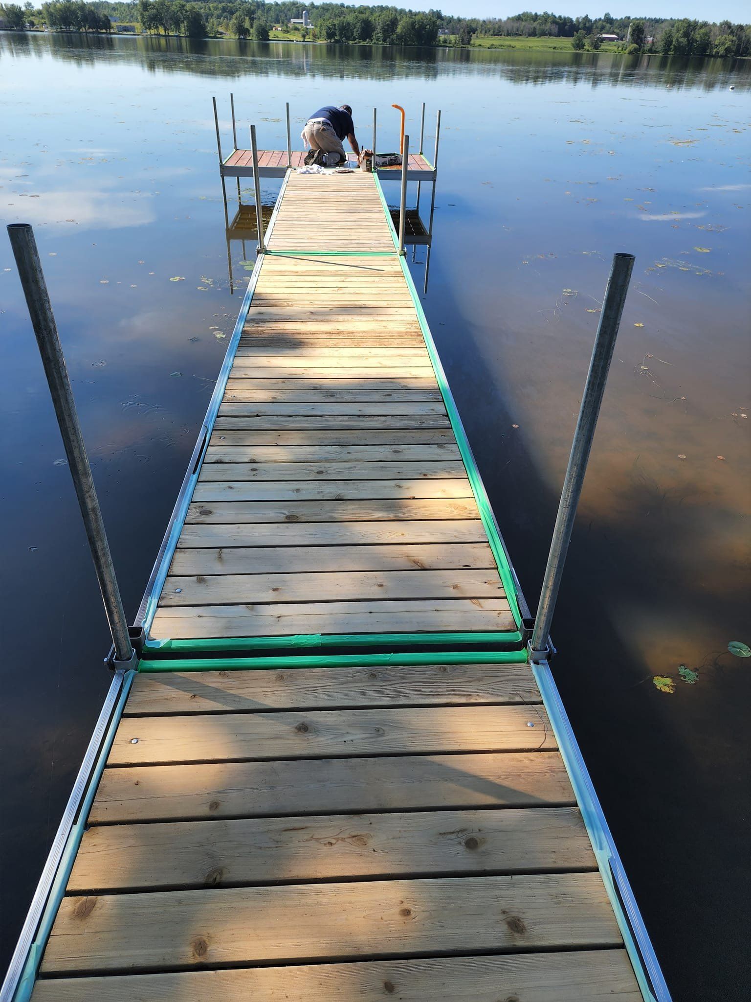 A wooden dock leading to a body of water