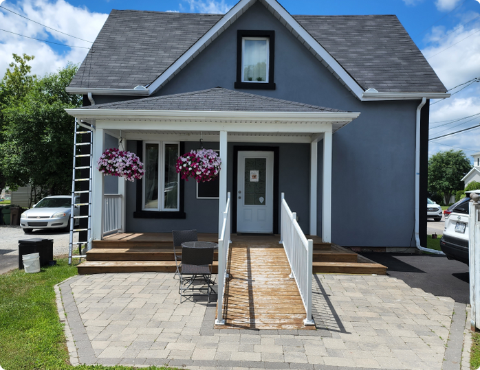 A house with a ramp leading to the front door