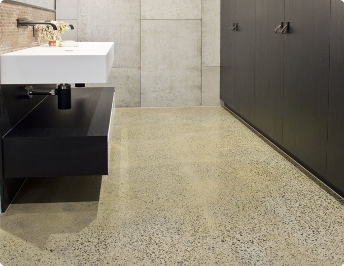 A bathroom with a sink and black cabinets