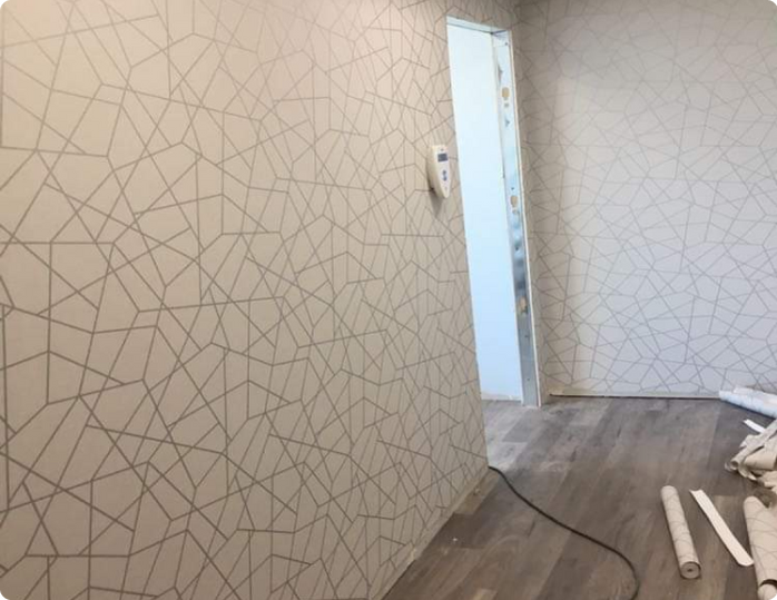 A room with a geometric pattern on the wall