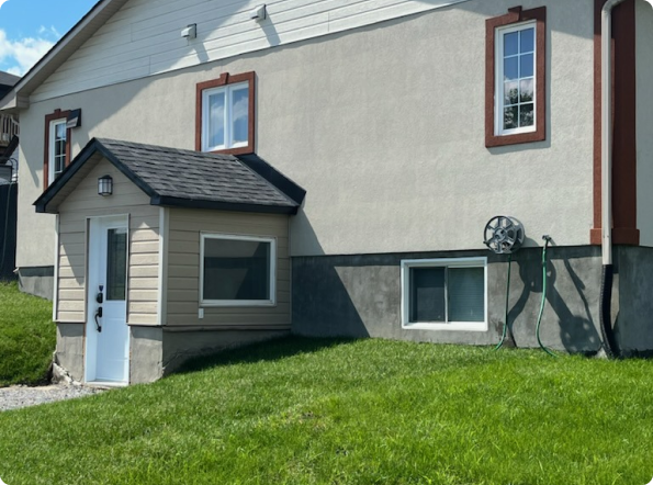 A house with a shed on the side of it