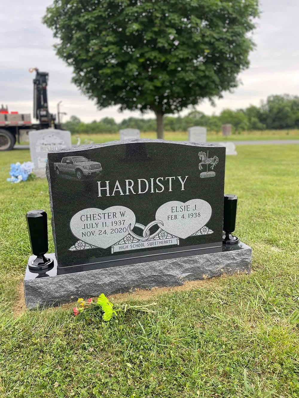 A black granite headstone with the name 