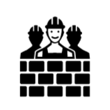 Un grupo de trabajadores de la construcción está parado junto a una pared de ladrillos.