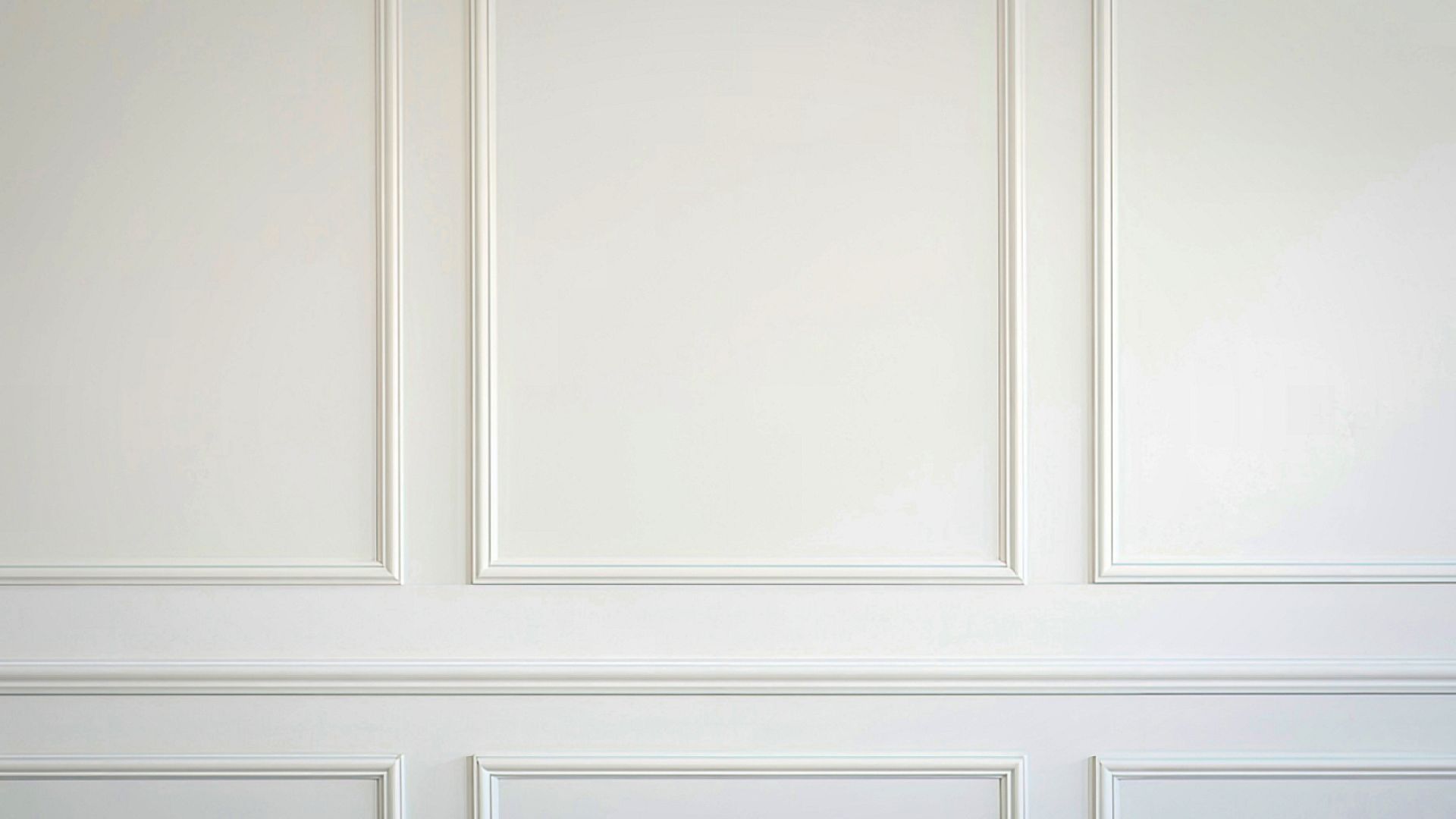 White paneled wall with decorative molding