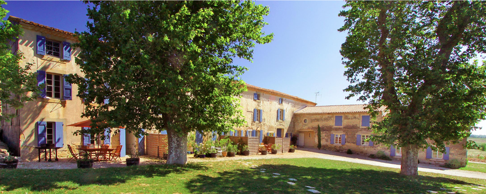 A large house with a lot of trees in front of it
