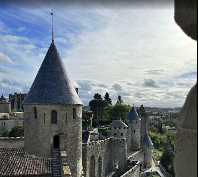 A castle with a large tower on top of it, Carcassonne, Fleur de Lys Retreats.