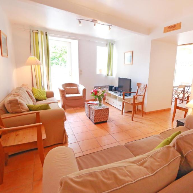 A living room filled with furniture and a television