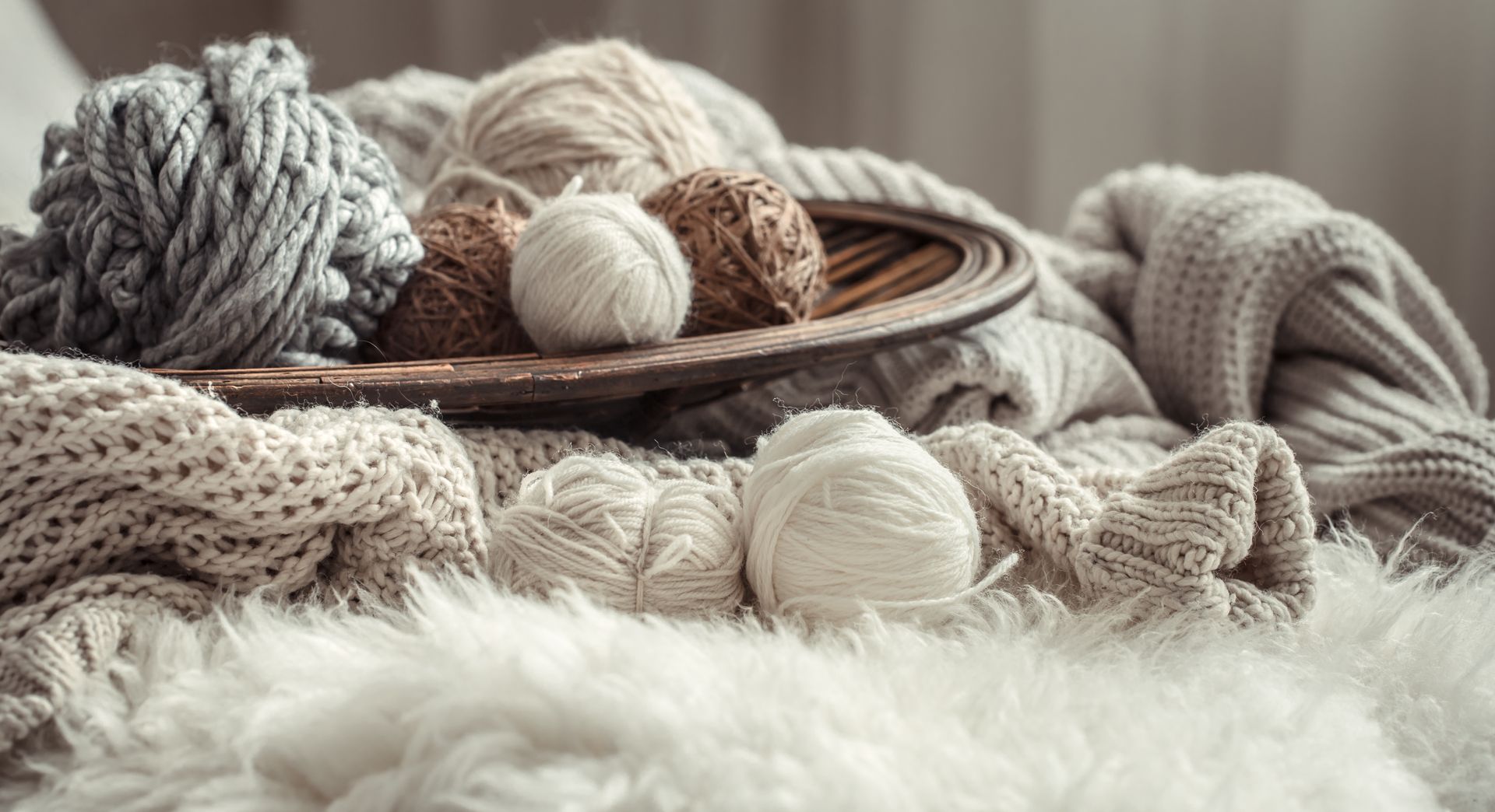 There are many balls of yarn on the table
