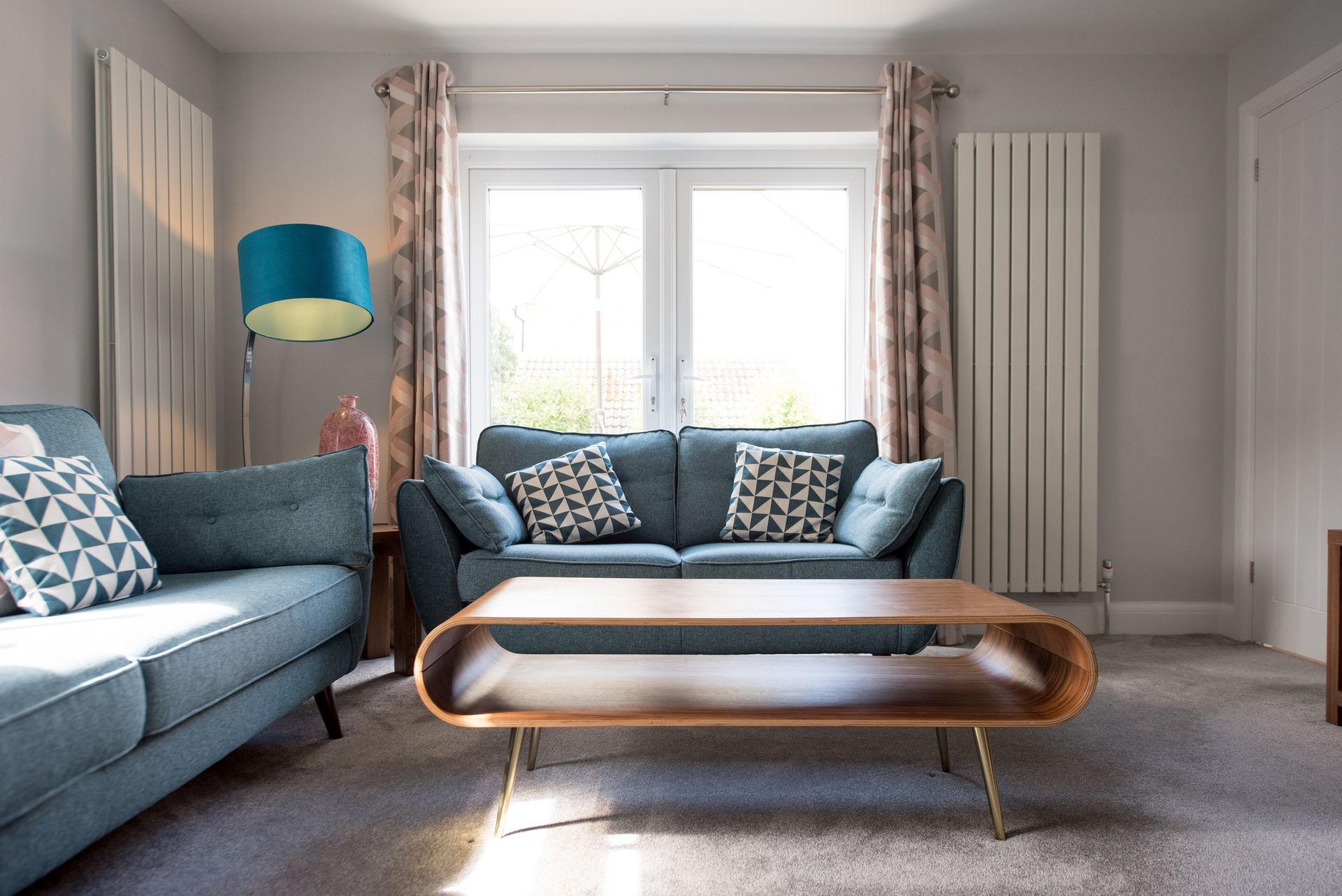 Retro Looking Blue Sofa, Coffee Table and Floor Lamp at Home – Greenwood Village, CO – Homestead Lending LLC