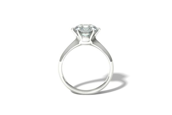 a silver ring with a diamond in the center