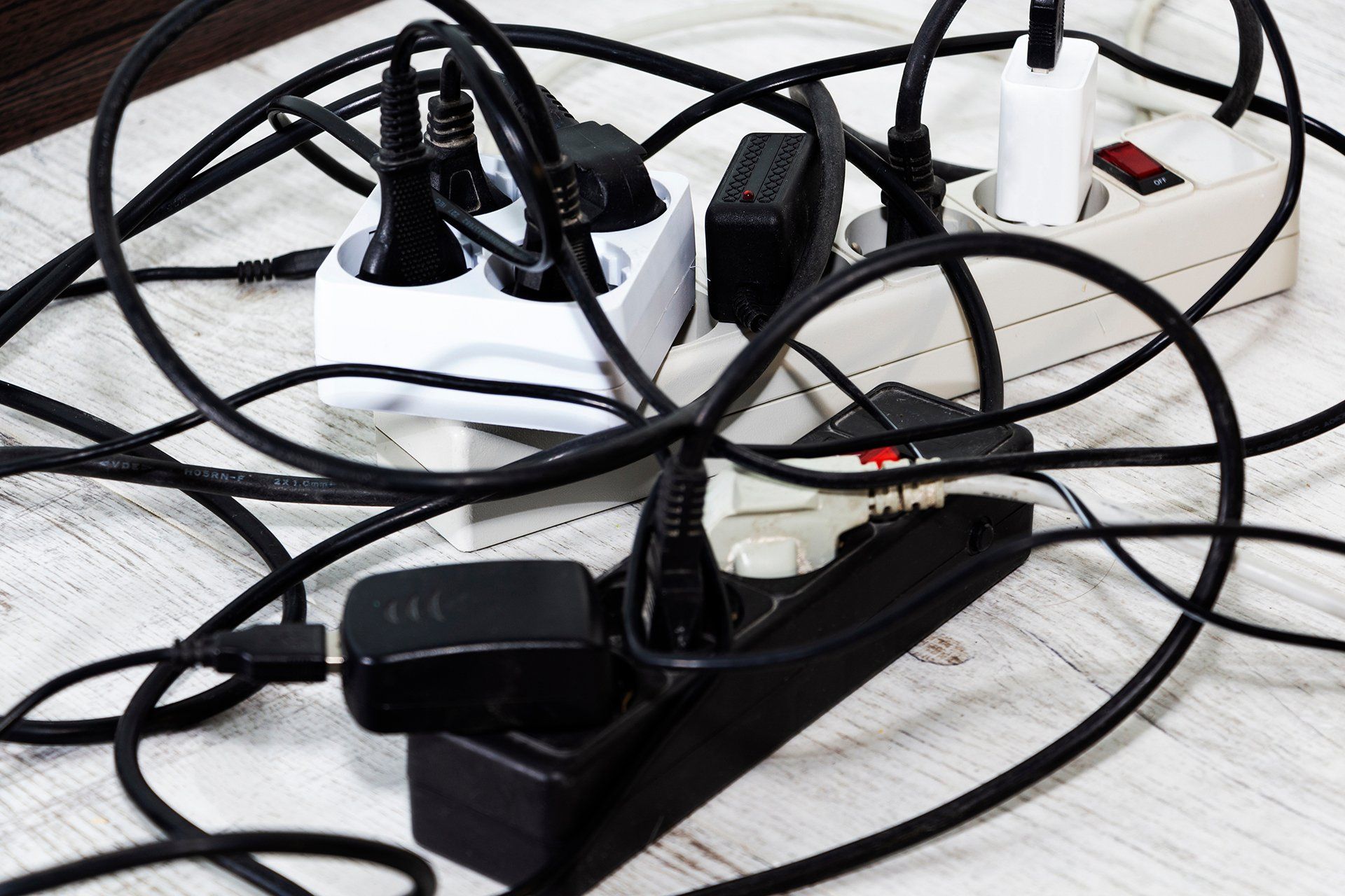 a crowded electrical outlet