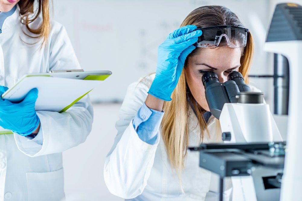 Biotechnology scientists working in laboratory