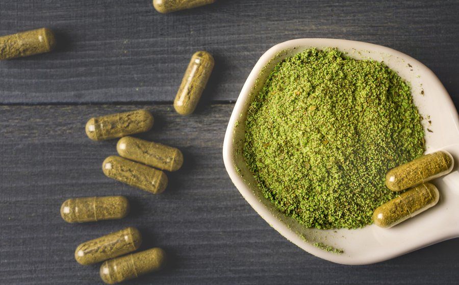 Powder and green capsules