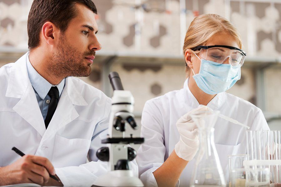 Two young scientists making experiments